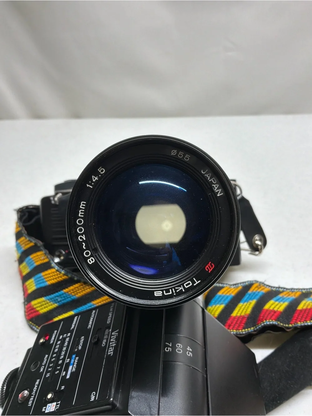 Canon T70 35mm SLR Camera with Black Telephoto Lens and Accessories